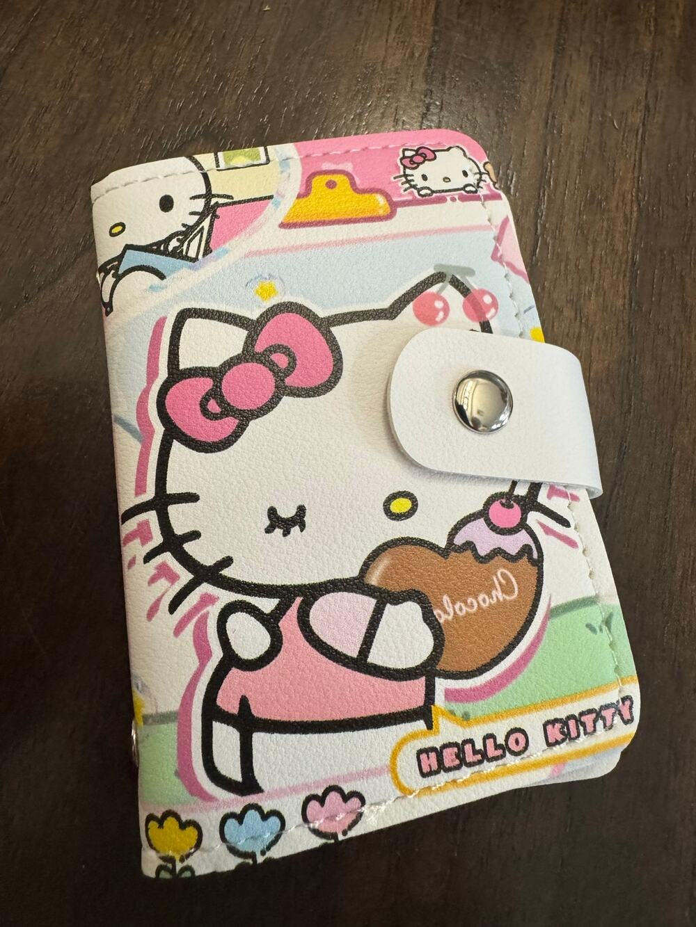 Hello Kitty wallet with Hello Kitty holding a chocolate bar graphic 10 slots